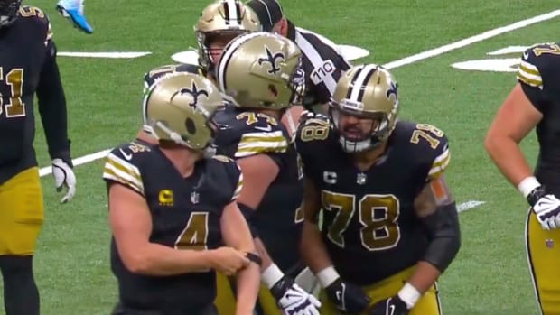 Saints center Erick McCoy shouts at quarterback Derek Carr after he was sacked.